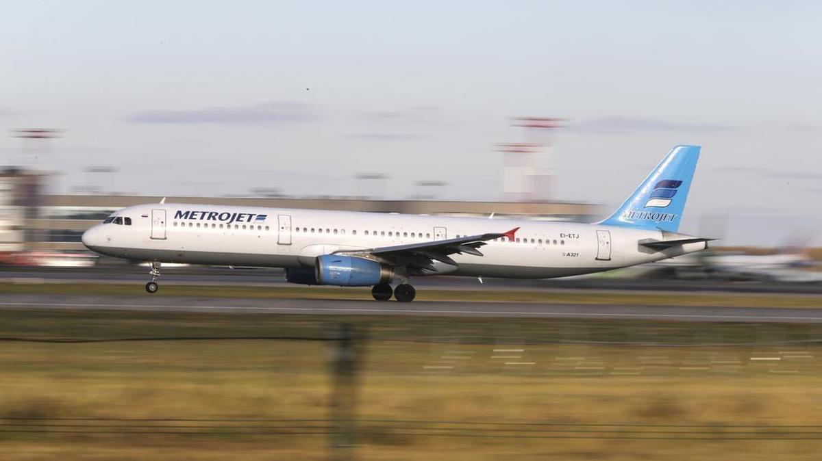 In this photo taken on Tuesday, Oct. 20, 2015, The Russian airline Kogalymavia’s Airbus A321 with a tail number of EI-ETJ on an airstrip of Moscow’s Domodedovo international airport, outside Moscow, Russia. Russia's civil air agency is expected to have a news conference shortly to talk about the Russian Metrojet passenger plane EI-ETJ, that Egyptian authorities say has crashed in Egypt's Sinai peninsula.