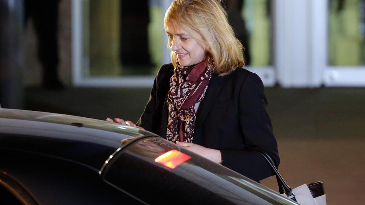 Spain's Princess Cristina leaves a makeshift courtroom on the first day of a corruption trial, in Palma de Mallorca, Spain, on Monday. She will make history as the first royal family member to face criminal charges since the monarchy was restored in 1975. She is accused of tax fraud related to a company she owned with her husband that allegedly helped fund the couple's lavish lifestyle.