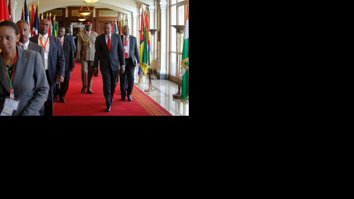 
Kenya's President Uhuru Kenyatta, center foreground, arrives for the Intergovernmental Authority on Development (IGAD) summit, held on the eve of the heads of state meeting of the African Union summit, in Addis Ababa, Ethiopia, Thursday, Jan. 29, 2015. The threat posed by Boko Haram, Nigeria's Islamic extremist rebels, will be a focus of U.N. Secretary-General Ban Ki-moon as he attends the African Union heads of state summit in Addis Ababa, Ethiopia, a spokesman said. 
