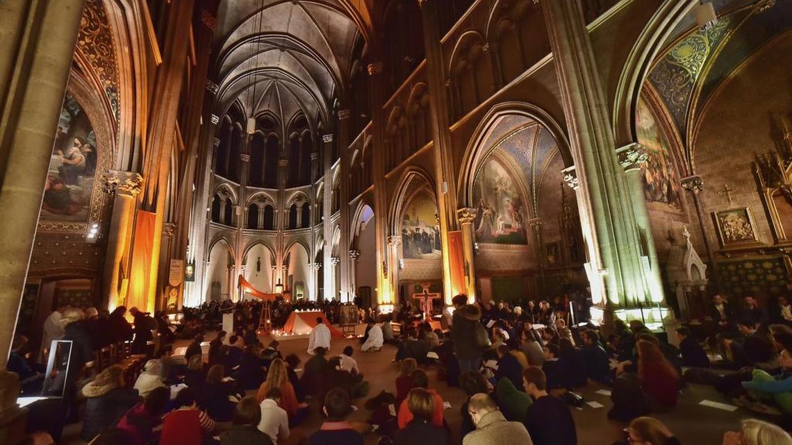 People pray at an interfaith service for world leaders to curb global warming during a multilingual service at Church St Ignatius in Paris on Saturday, Dec. 5, 2016. The cold hard numbers of science haven't spurred the world to curb runaway global warming. So as climate negotiators struggle in Paris, some scientists who appealed to the rationale brain are enlisting what many would consider a higher power: the majesty of faith.