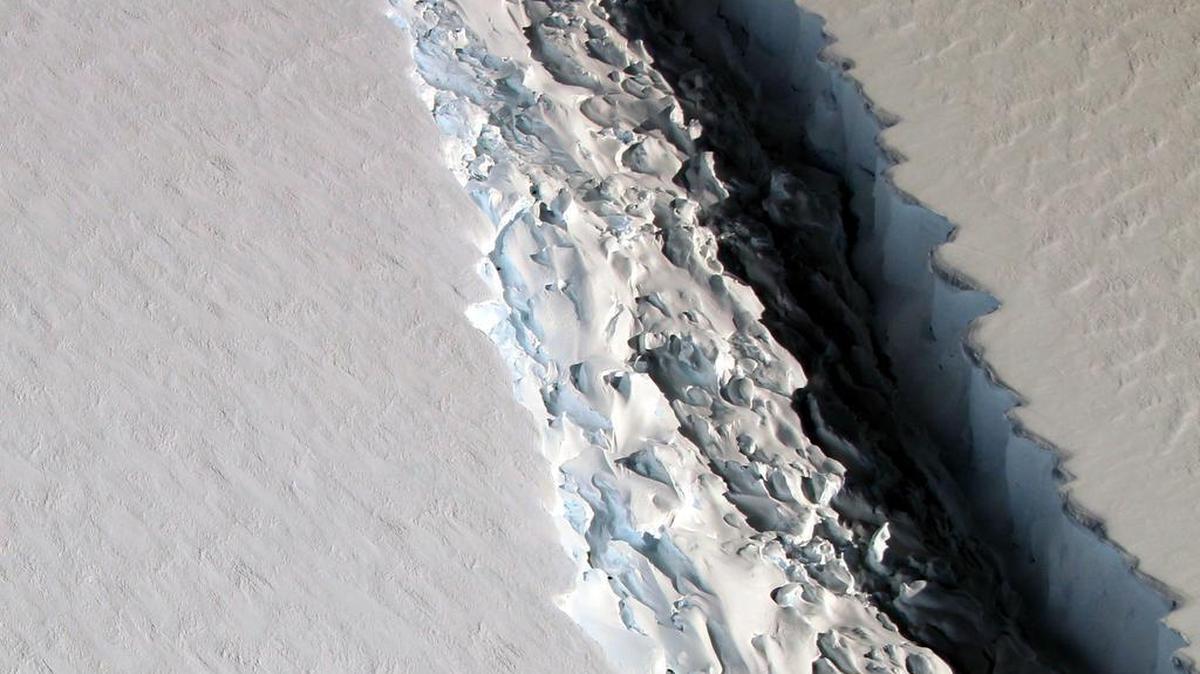 This Nov. 10, 2016 aerial photo released by NASA, shows a rift in the Antarctic Peninsula's Larsen C ice shelf. According to NASA, IceBridge scientists measured the Larsen C fracture to be about 70 miles long, more than 300 feet wide and about a third of a mile deep.