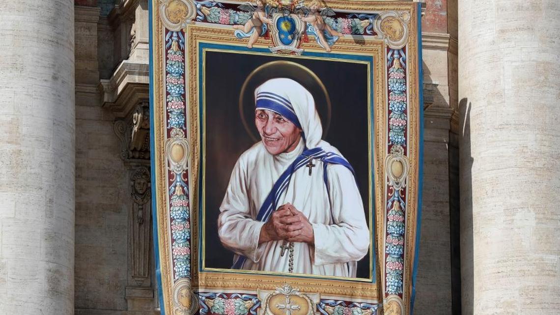 A tapestry picturing Mother Teresa hangs from the central balcony of St. Peter's Basilica in St. Peter's Square where Pope Francis will canonize her on Sunday.