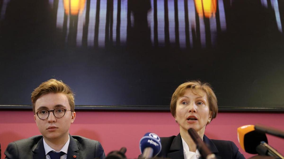 Marina Litvinenko, widow of former Russian spy Alexander Litvinenko, speaks Thursday during a press conference with her son Anatoly in London.