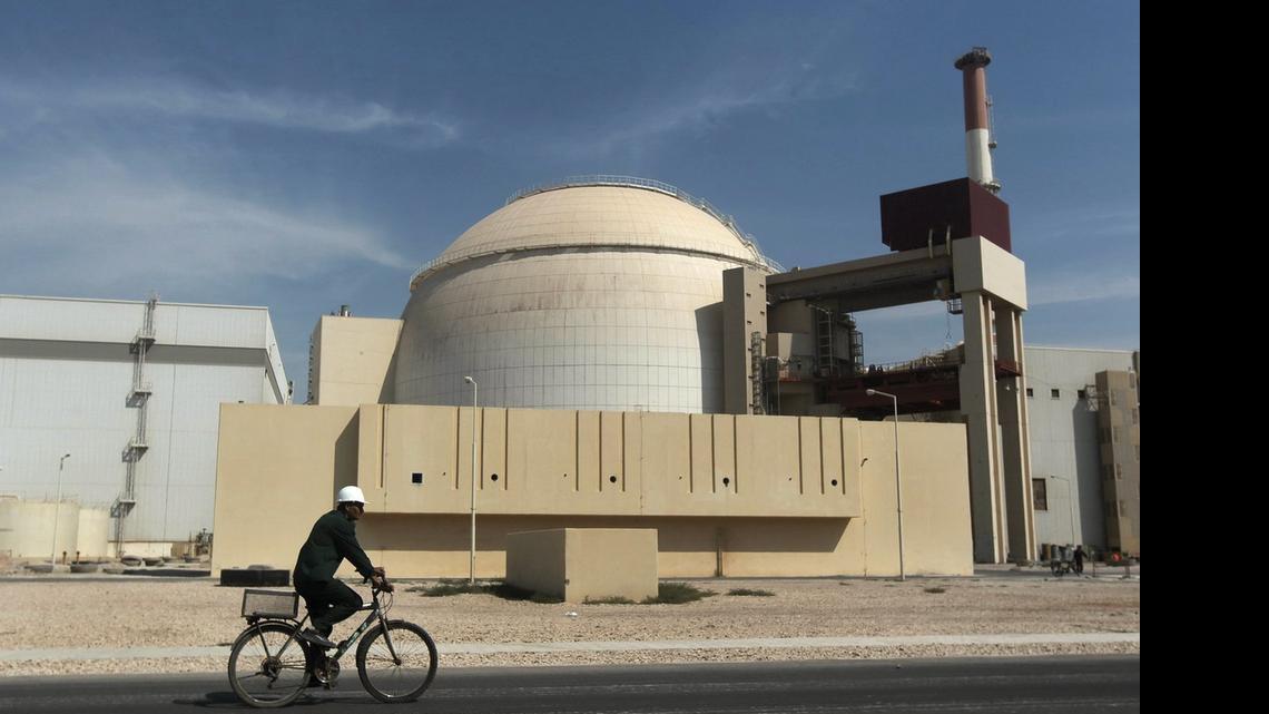 
A worker rides a bicycle in front of the reactor building of a nuclear power plant, just outside the southern city of Bushehr, Iran, on Oct. 26, 2010. The terms of the agreement reached today involve lifting economic sanctions against Iran in exchange for stricter monitoring of their nuclear program so the country doesn’t build nuclear weapons.
