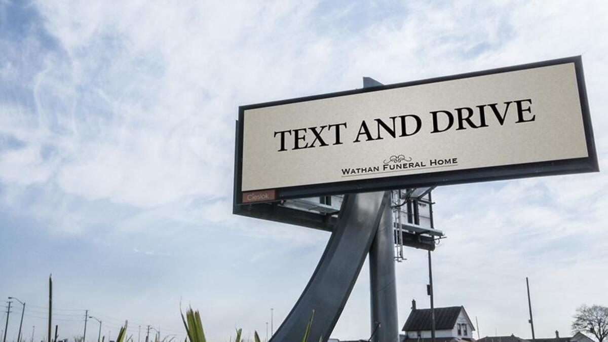 The billboard displayed in Toronto is a public service ad campaign to get people to stop the deadly practice.