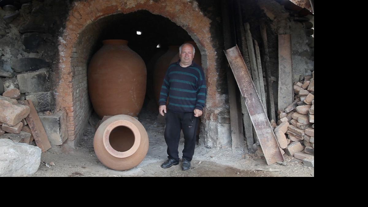 Potter Remi Kbilashvili makes qvevris, or clay pots used in Georgian wine making, in his backyard workshop on April 9, 2015. Wine planning under the Soviet Union sidelined this 8,000-year-old tradition, but now the qvevri is at the forefront of a back-to-the-roots wine revolution in Georgia.