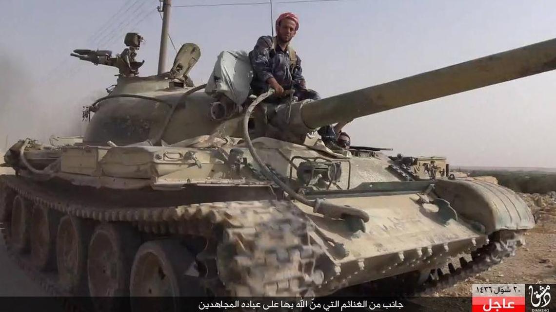 
An Islamic State militant in a Syrian government tank captured Aug. 5 at Qaryatain in central Syria.
