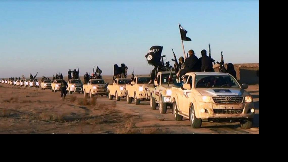 
This image posted on a militant website on Tuesday, Jan. 7, 2014, which is consistent with AP reporting, shows a convoy of vehicles and fighters from the al-Qaida-linked Islamic State of Iraq and the Levant (ISIL) fighters in Iraq's Anbar Province. 
