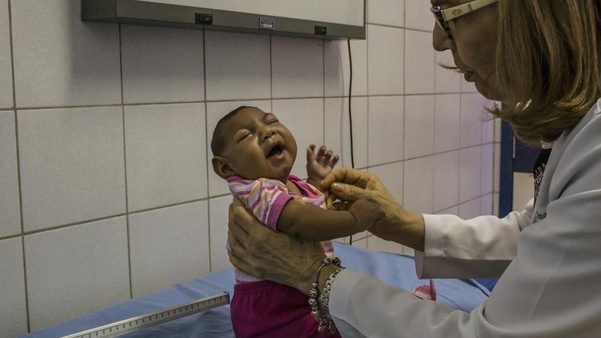 Dr. Angela Rocha examines 3-month-old Annika Vitoria, born with microcephaly, at a hospital in Recife, Brazil, on Jan. 29, 2016. The surging medical reports of babies born with unusually small heads during the Zika epidemic in Brazil are igniting a fierce debate over the country’s abortion laws, which make the procedure illegal under most circumstances.