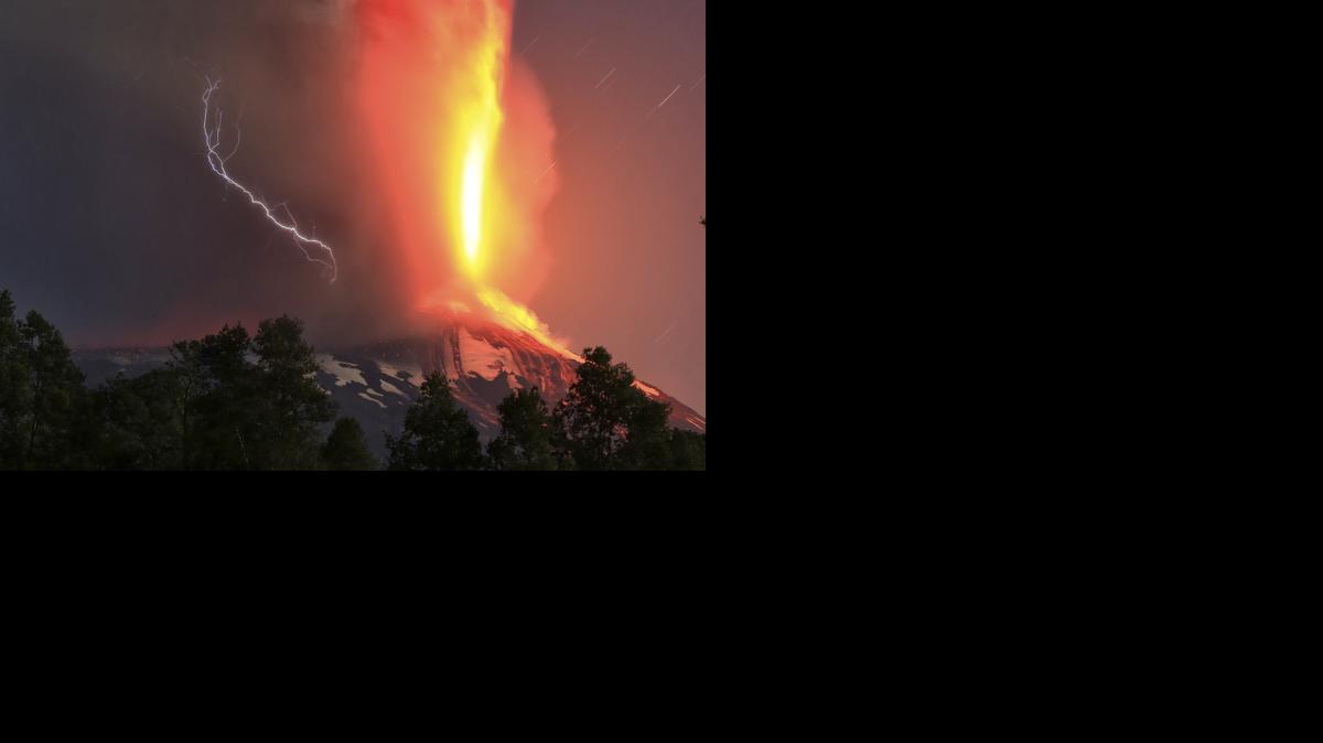 
The Villarica volcano erupts near Pucon, Chile, early Tuesday, March 3, 2015. The Villarica volcano erupted Tuesday around 3 a.m. local time (0600 GMT), according to the National Emergency Office, which issued a red alert and ordered evacuations.
