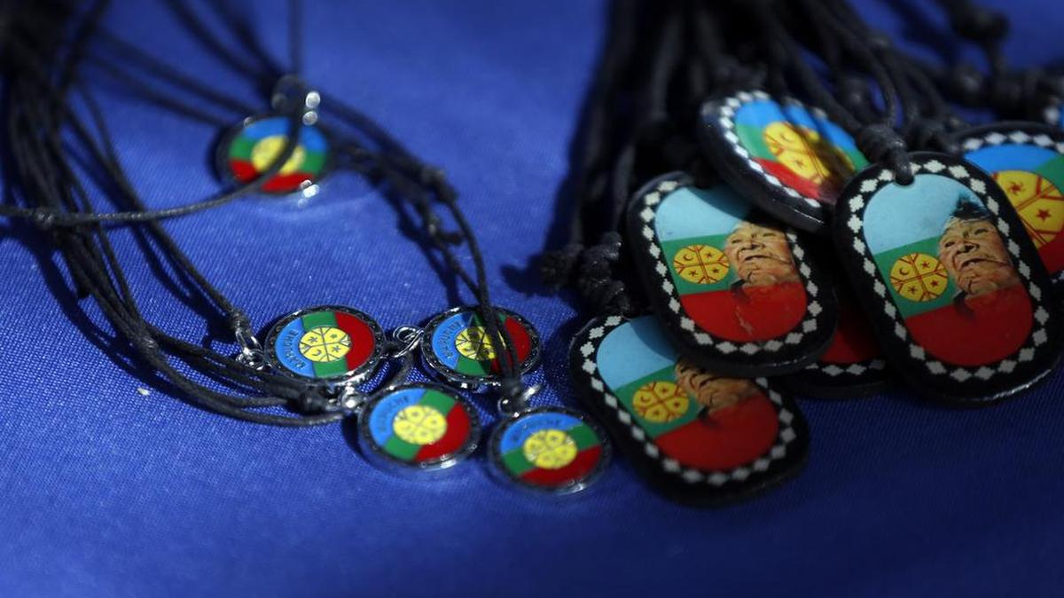 
Necklaces with the Mapuche flag design are displayed for sale in Santiago, Chile, on July 29. Popular singer Ana Tijoux has waved the multicolored Mapuche flag during her concerts and raps about their struggle in her Grammy-nominated albums.
