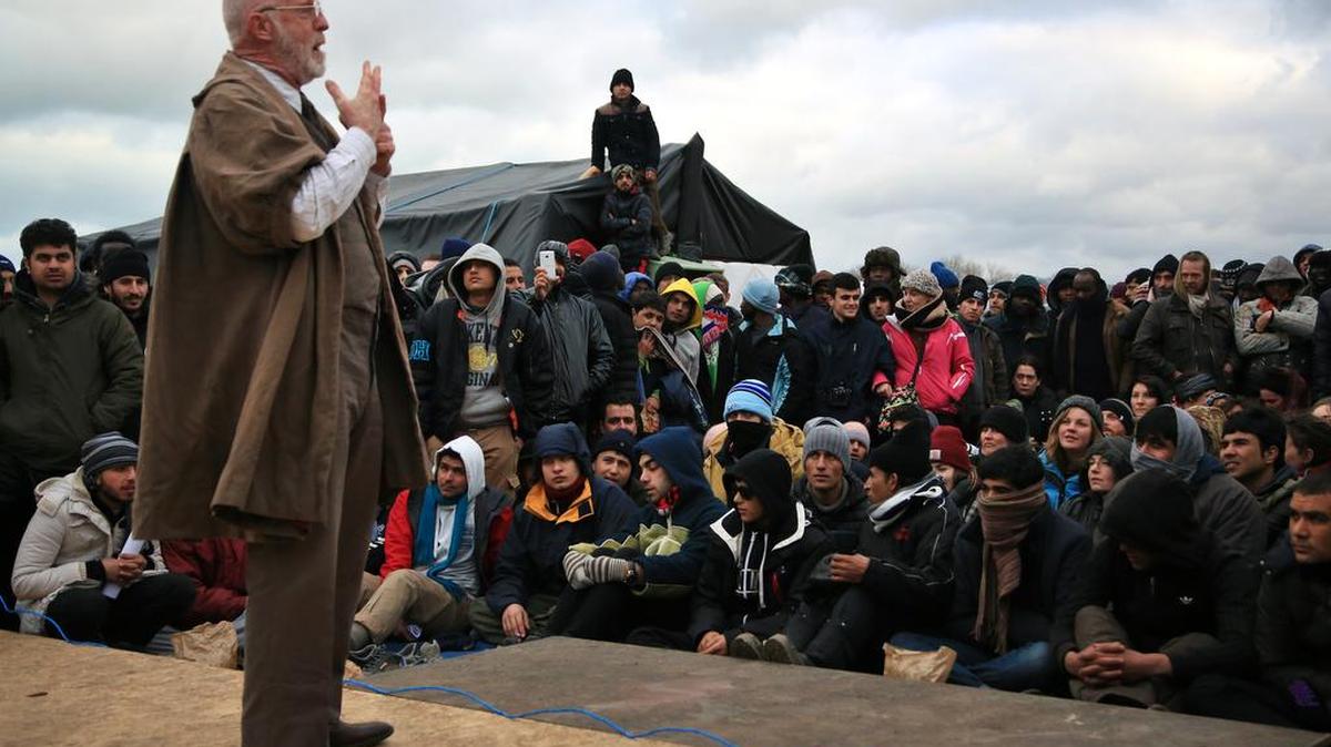 An actor performs in Hamlet, Wednesday in the refugees camp of Calais, northern France. The Globe theater company took “Hamlet” to Calais , bringing one of Shakespeare’s best-known plays to an audience that almost certainly would rather see it in his native country. The play is hosted by the Good Chance theater in the heart of the camp, one of numerous structures set up by volunteers to fill the void for its displaced residents.