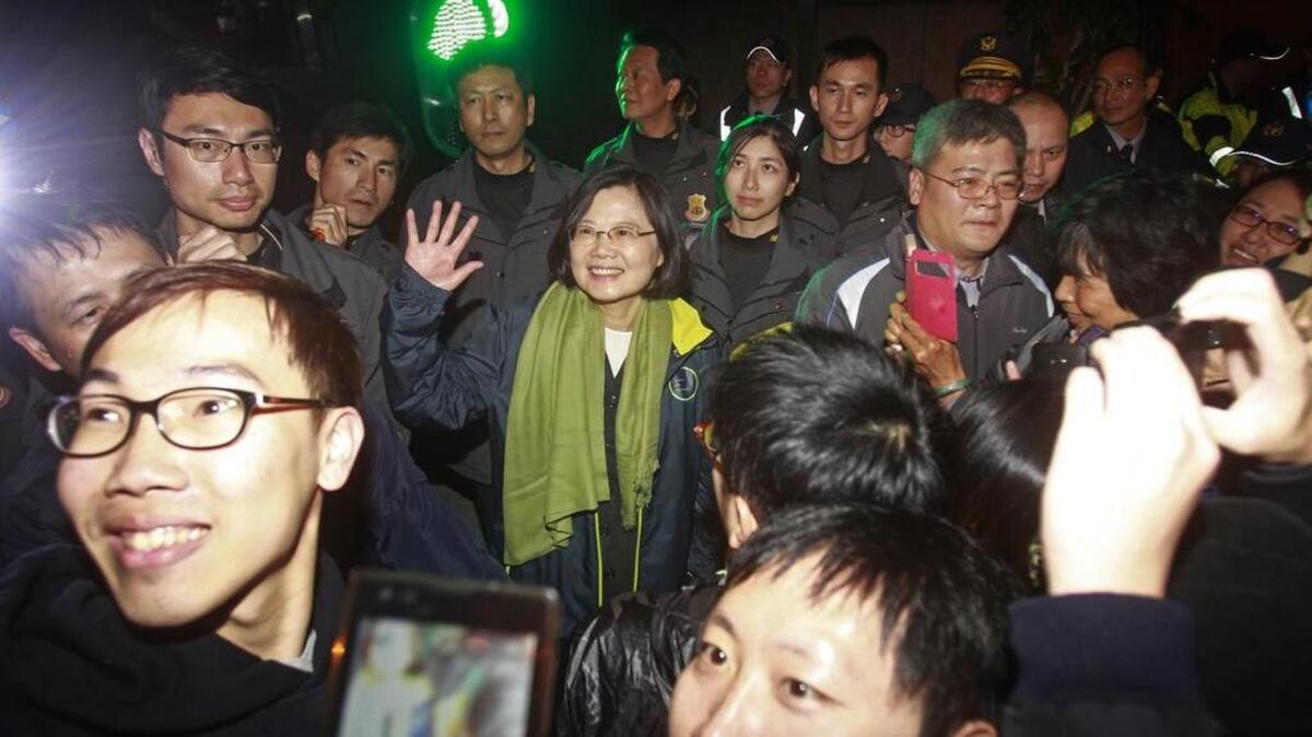 Taiwan’s Democratic Progressive Party, DPP, Tsai Ing-wen, center, greets waiting supporters after winning the presidential election on Saturday, Jan. 16, 2016, in Taipei, Taiwan. Pro-independence party candidate Tsai Ing-wen claimed victory in Taiwan’s presidential election late Saturday, defeating the China-friendly party that has led the self-governing island for eight years and soon to be come its first female head of state.
