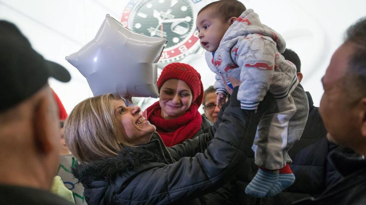 Tima Kurdi, left, lifts up her 5-month-old nephew, Sherwan Kurdi, after her brother, Mohammad Kurdi, and his family, who escaped conflict in Syria, arrived at Vancouver International Airport, Monday, Dec. 28, 2015. Kurdi’s 3-year-old nephew, Alan Kurdi, drowned along with his 5-year-old brother and their mother while crossing the waters between Turkey and Greece in September.