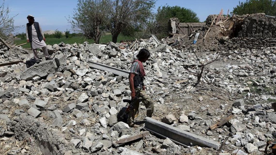 An Afghan security police officer at a destroyed house after an operation in Asad Khil near the site of a U.S. bombing in the Achin district of Jalalabad, east of Kabul, Afghanistan, April 17, 2017. U.S. forces in Afghanistan had struck an Islamic State tunnel complex in eastern Afghanistan earlier in the week with the largest non-nuclear weapon ever used in combat by the U.S. military, Pentagon officials said.