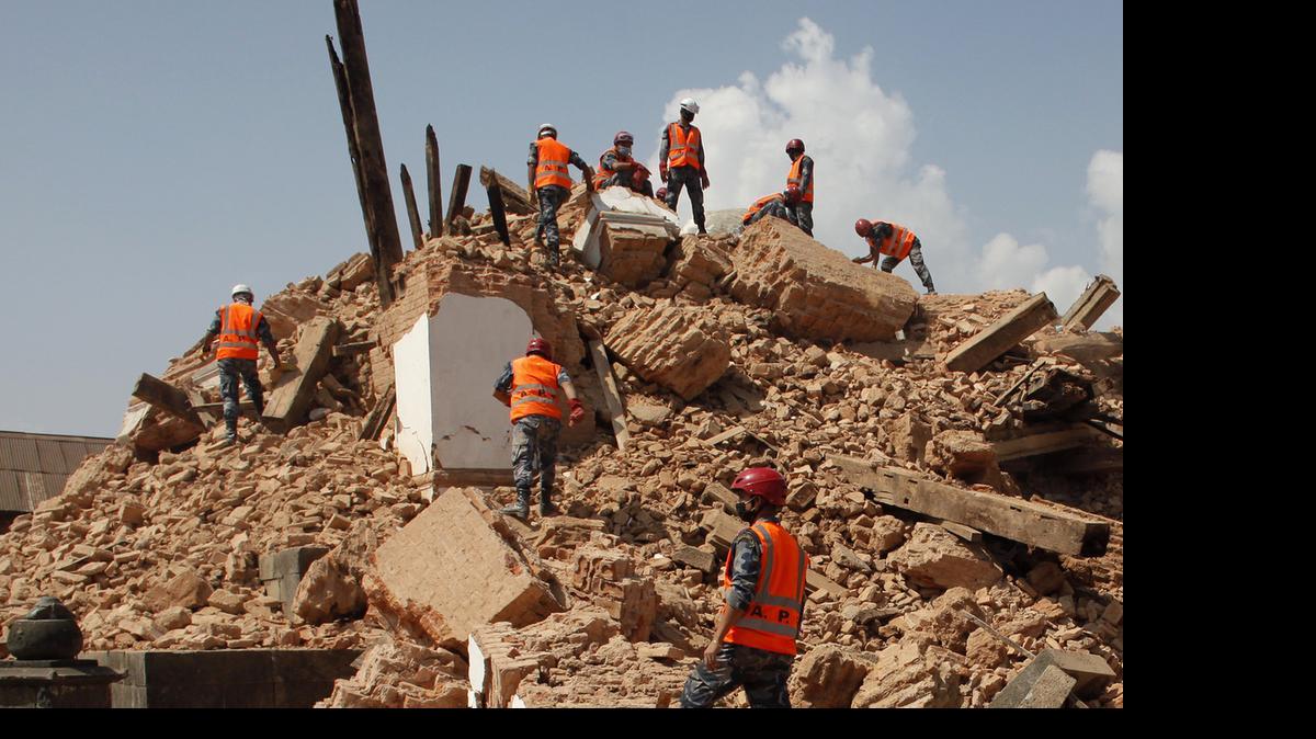 
Nepalese soldiers clear the debris at the Kaalmochan temple in Kathmandu, Nepal, Saturday, May 2, 2015. 
