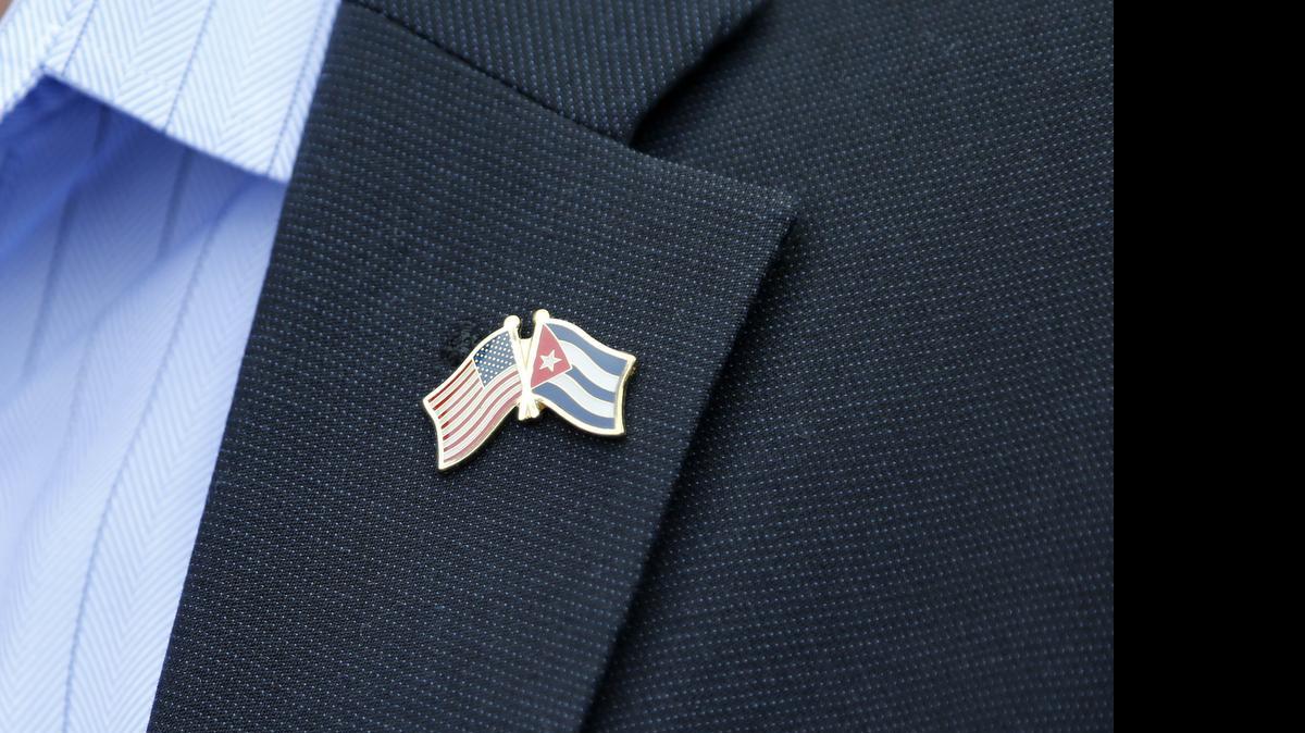 
A flag pin worn by a member of a U.S. Senate delegation in Havana, Cuba, represents the two countries moving toward normalizing relations. Much work remains to be done. Embassies are to be reopened July 20.
