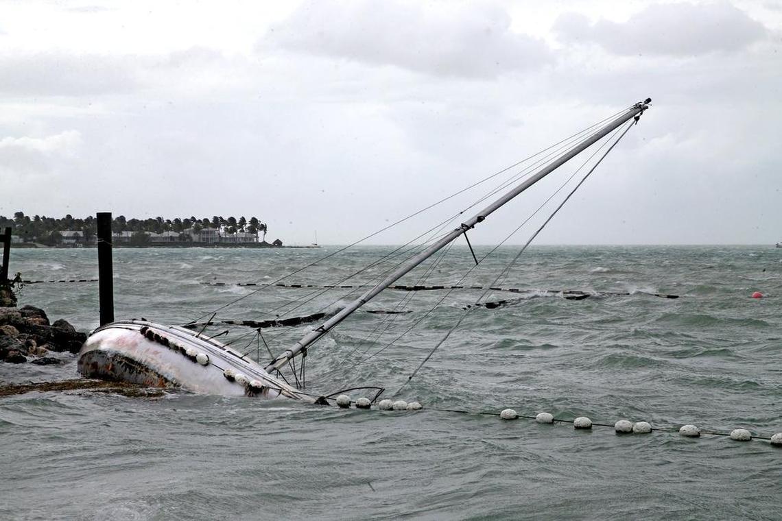 A sailboat crashes on the shore near Mallory Square Saturday as Irma’s winds whipped up waves.