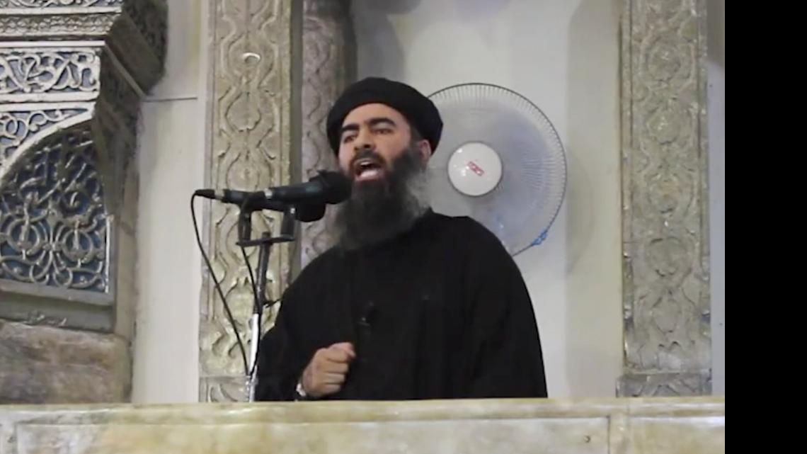 
Abu Bakr al Baghdadi, the leader of the Islamic State group shown in July 5, 2014, has apparently made a new audio recording to prove that he is not incapacitated by injuries from coalition airstrikes. In the recording released Thursday, May 15, 2015, on the Internet, he called on all Muslims to join the caliphate he leads in Iraq and Syria. “There is no excuse for any Muslim not to migrate to the Islamic State,” he said. “Joining is a duty on every Muslim.”
