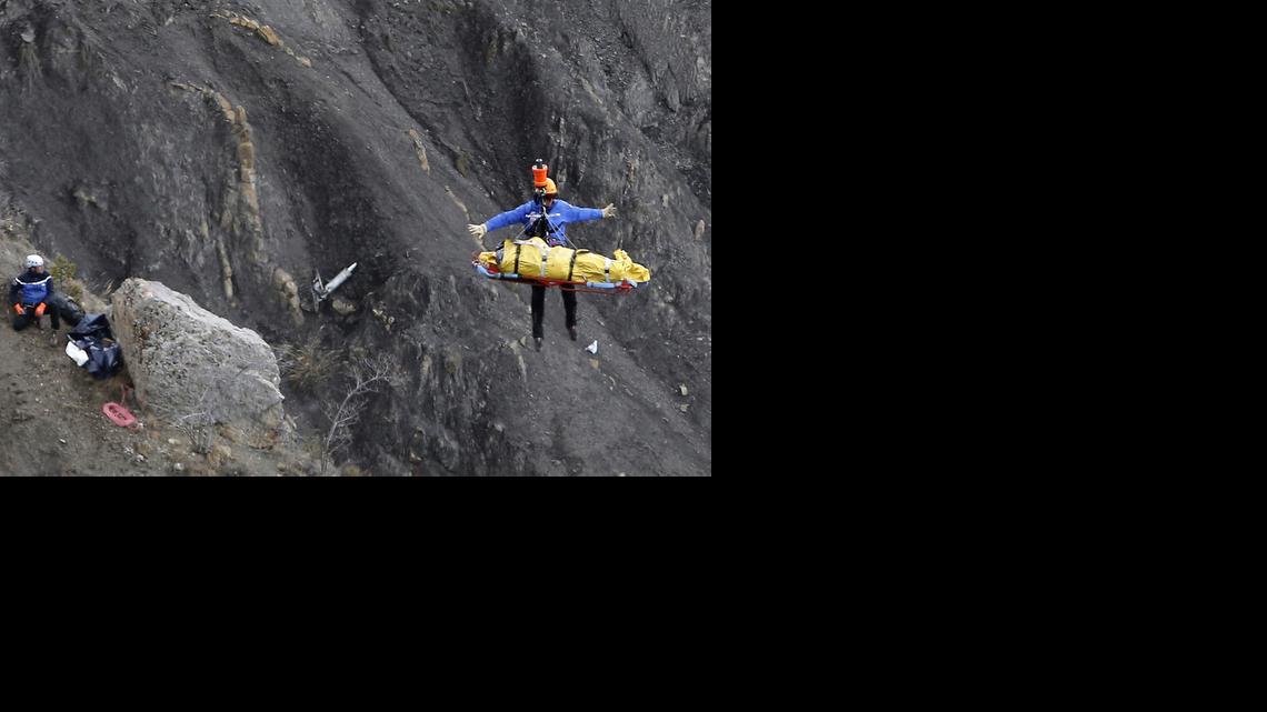 
A rescue worker is lifted into an helicopter at the crash site near near Seyne-les-Alpes, France, on Thursday, March 26, 2015.
