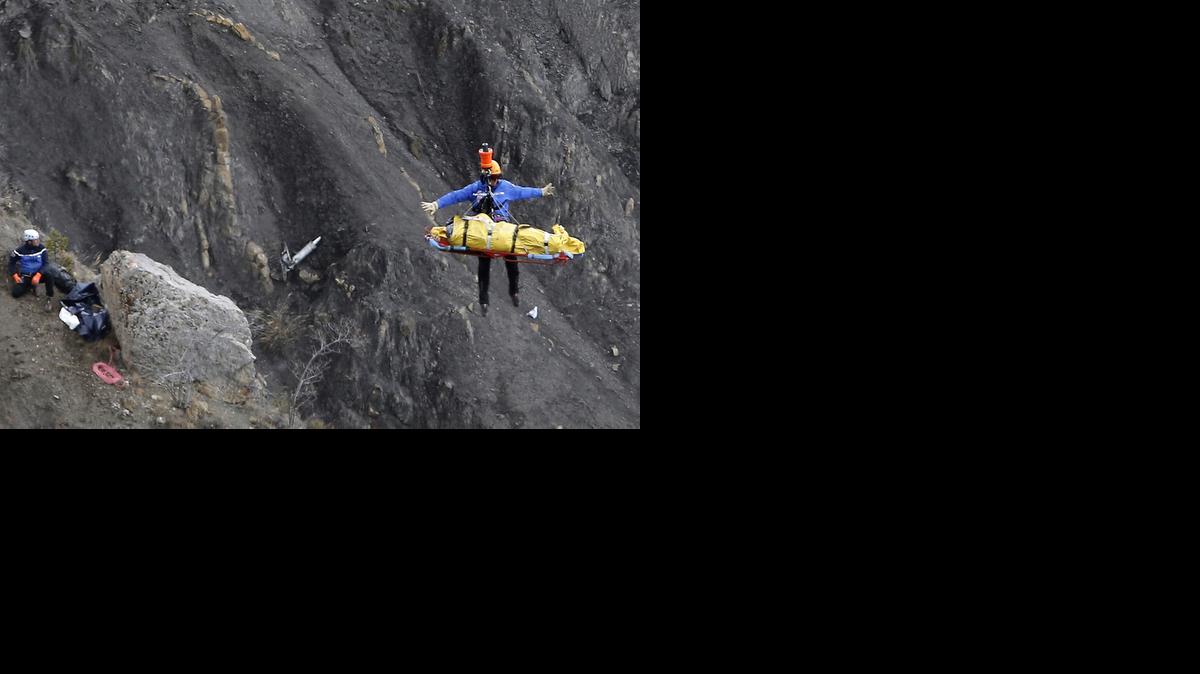 
A rescue worker is lifted into an helicopter at the crash site near near Seyne-les-Alpes, France, on Thursday, March 26, 2015.
