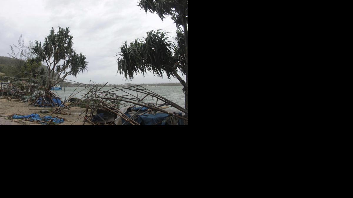 
In this March 14, 2015, photo provided by World Vision, debris is scattered along the coast in Port Vila Vanuatu, after Cyclone Pam ripped through the tiny South Pacific archipelago. Packing winds of 270 kilometers (168 miles) per hour, Cyclone Pam tore through Vanuatu early Saturday, leaving a trail of destruction. 
