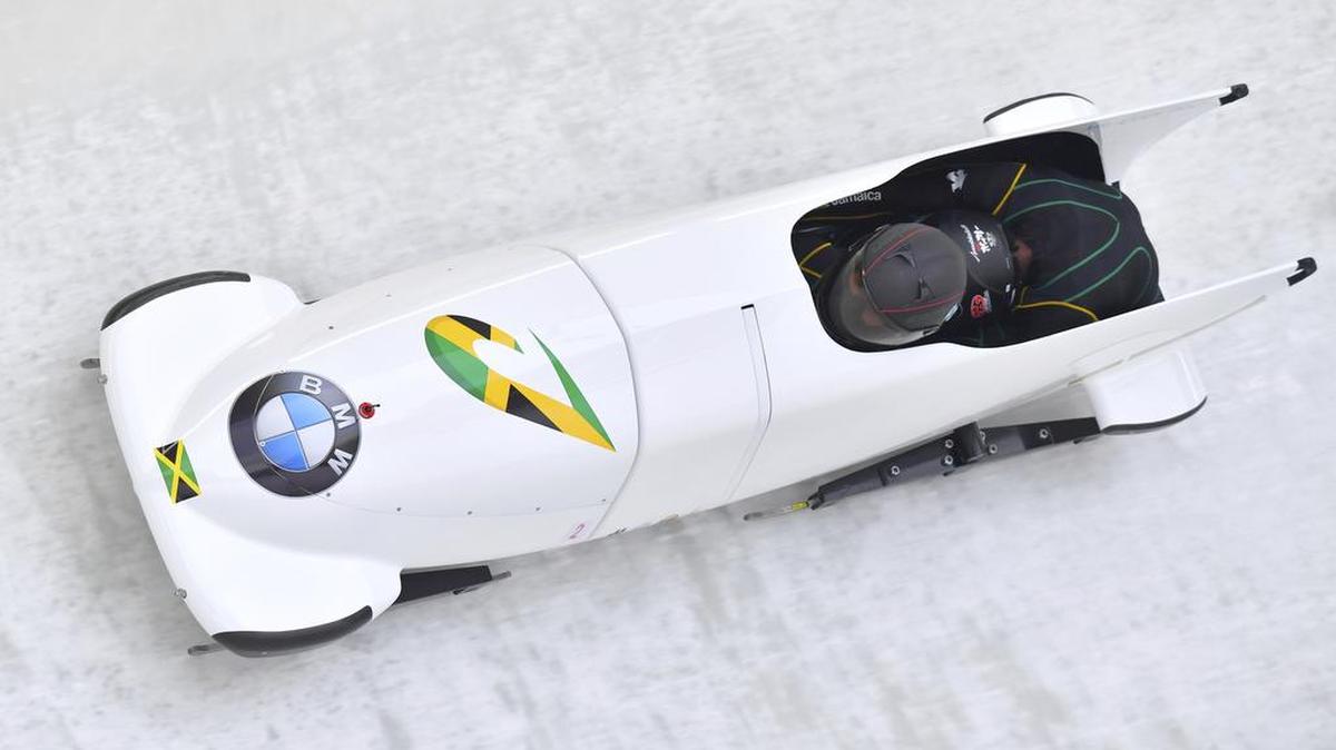 Jazmine Fenlator-Victorian and Carrie Russell of Jamaica speed down the track during their first run of the women's bobsled World Cup race in Decembed 2017.
