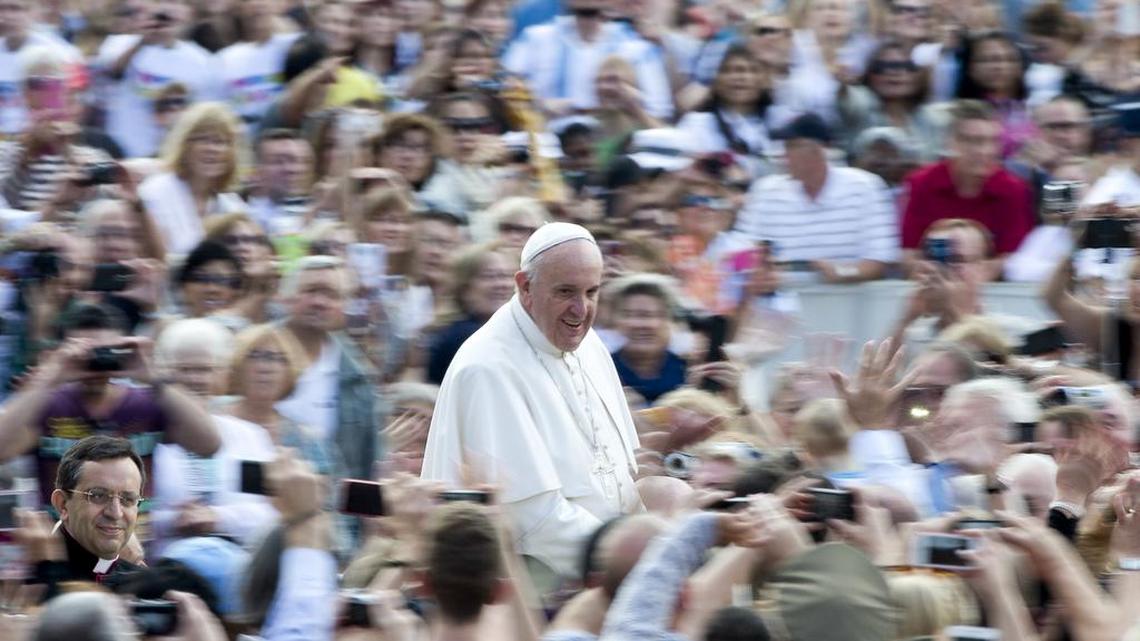 
Pope Francis is driven through the crowd as he arrives for his weekly general audience in St. Peter's Square at the Vatican, Wednesday, Oct. 7, 2015.
