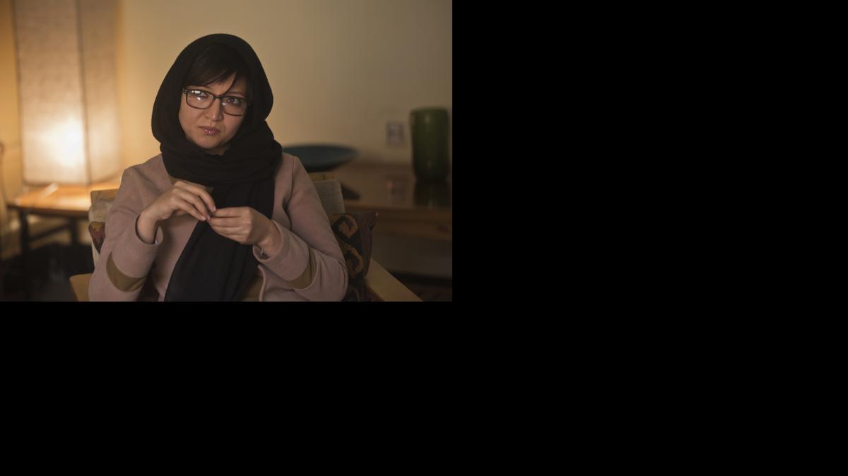 
In this Thursday, March 5, 2015, Afghan performance artist Kubra Khademi appears during an interview with The Associated Press in Kabul, Afghanistan. Khademi donned a suit of armor with large breasts and buttocks and wore it on the streets of Kabul to protest Afghanistan’s endemic harassment. The eight-minute performance was not well received: She is now in hiding and afraid for her life. 

