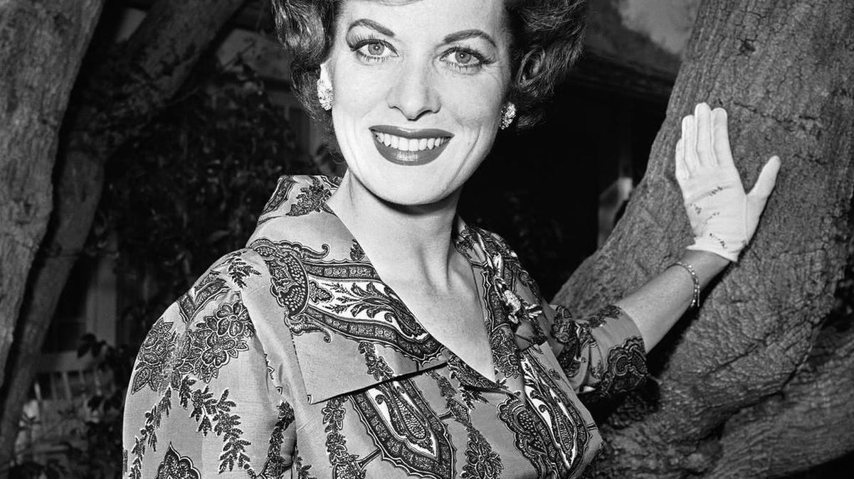 Movie actress Maureen O’Hara photographed in her front yard in Los Angeles in 1960. O'Hara,who appeared in such classic films as "The Quiet Man” and How Green Was My Valley," has died. Her manager says O’Hara died in her sleep Saturday, Oct. 24, 2015 at her home in Boise, Idaho.