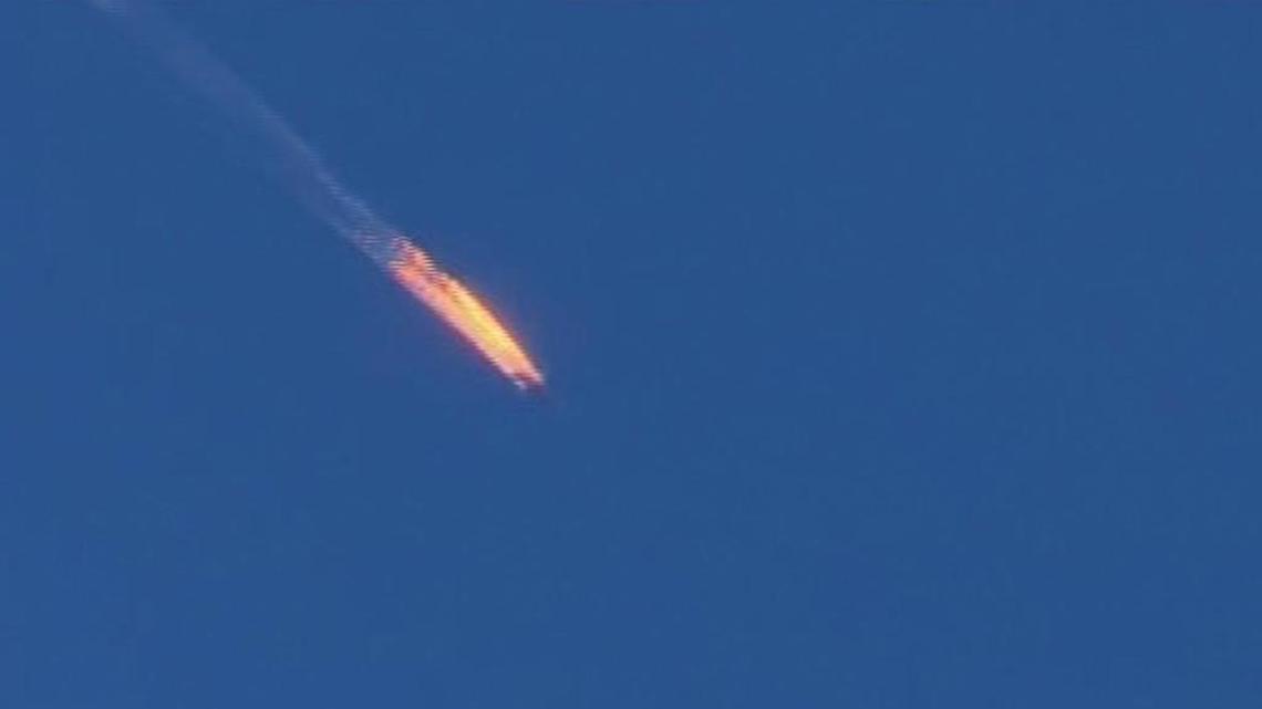 This frame grab from video by Haberturk TV, shows a Russian warplane on fire before crashing on a hill as seen from Hatay province, Turkey, Tuesday, Nov. 24, 2015. Turkey shot down the Russian warplane Tuesday, claiming it had violated Turkish airspace and ignored repeated warnings. Russia denied that the plane crossed the Syrian border into Turkish skies.