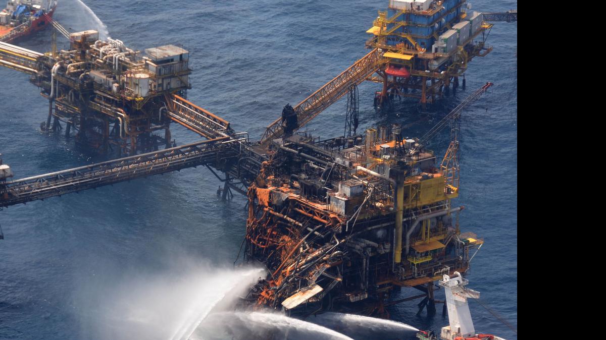 
In this April 2, 2015, handout photo provided by Petroleos Mexicanos (Pemex), emergency boats works to put out a fire at the Abkatun-A Permanente shallow-water oil platform in the Campeche Sound. On May 5, 2015, Pemex said emergency boats evacuated 101 workers from another rig, the Troll Solution, after “a failure of one of its legs” caused a partial collapse. 
