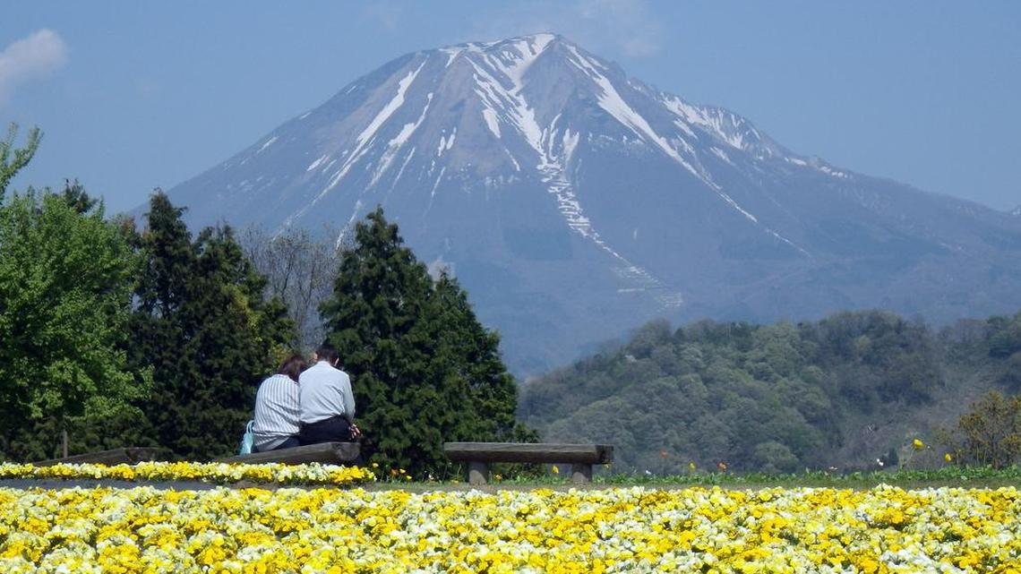 A couple takes in the view in Tottori Prefecture, Japan, on April 23, 2014. A number of young Japanese have little or no interest in sex. Preferring to enjoy their single lifestyle and ignore the pressures of a relationship, it's not uncommon to go without sex for a decade or more. The situation further complicates an already difficult issue of population decline in Japan.
