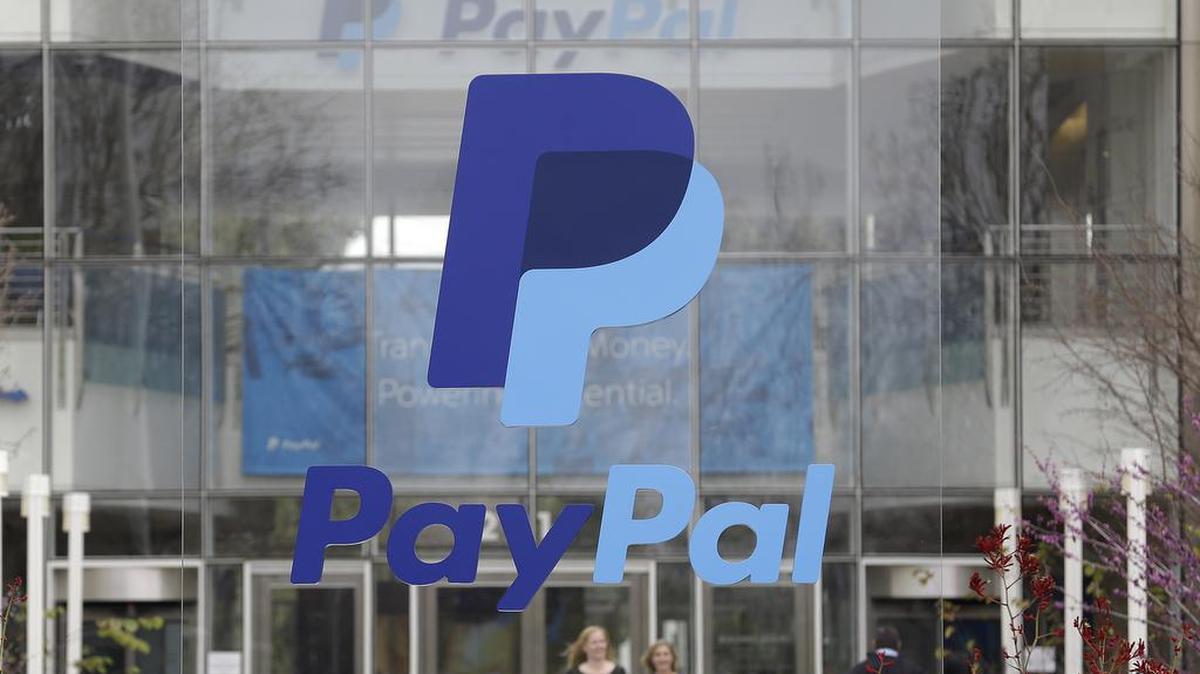 A PayPal sign outside of the main entrance to an office building in San Jose, California.