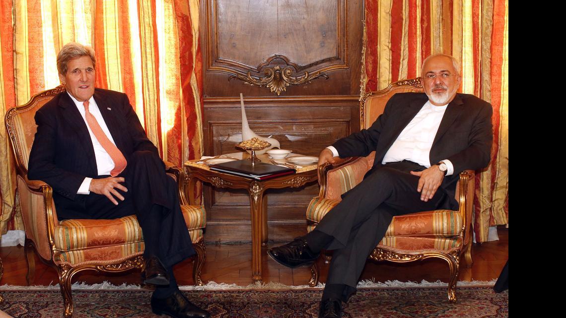 
U.S. Secretary of State John Kerry, left, meets with Iran's Foreign Minister Mohammad Javad Zarif, Monday, April 27, 2015, in New York. Iranian forces fired warning shots across the bridge of a Marshall Islands-flagged cargo vessel as it was traversing the Strait of Hormuz in Iranian territorial waters, boarded the ship and directed it toward the Iranian mainland, a Pentagon official said Tuesday. The incident, which prompted the U.S. Navy to dispatch a destroyer and a plane in response, comes as Iran and the U.S. along with other world powers try to hammer out a final deal over Tehran’s nuclear program. 
