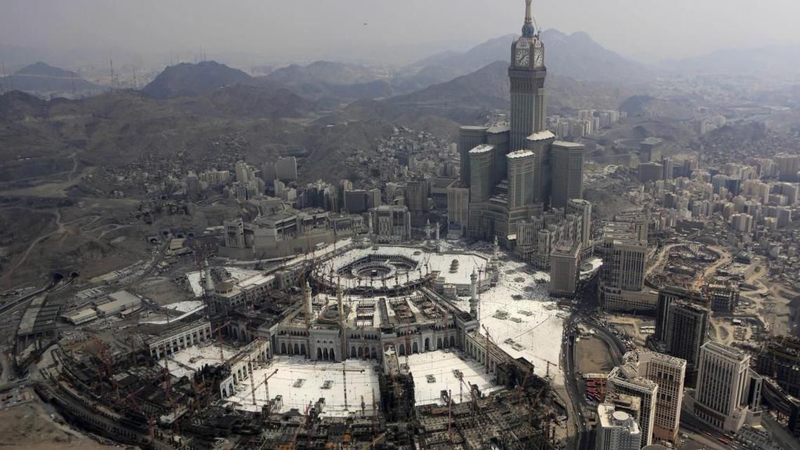 
In this Sunday, Oct. 5, 2014, photo, the Abraj Al-Bait Towers with the four-faced clocks stands over the holy Kabaa, as Muslims encircle it inside the Grand Mosque during the annual pilgrimage, known as the hajj, in the Muslim holy city of Mecca, Saudi Arabia. Saudi Arabia's civil defense authority says dozens of people have been killed after a crane collapsed on the Grand Mosque in the holy city of Mecca on Friday, Sept. 11, 2015. 
