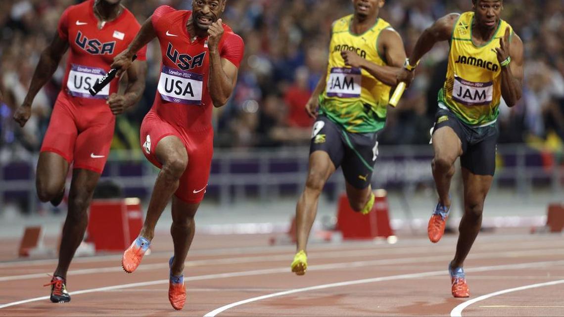 
In this Saturday, Aug. 11, 2012 file photo, from left, United States' Justin Gatlin hands the baton to Tyson Gay, as Jamaica's Michael Frater hands the baton to Yohan Blake in the men's 4x100-meter relay final during the athletics in the Olympic Stadium at the 2012 Summer Olympics, London. Two officials with knowledge of the decision say the entire U.S. men’s sprint relay team has been stripped of its silver medal from the 2012 London Olympics as a result of Tyson Gay’s doping case. 
