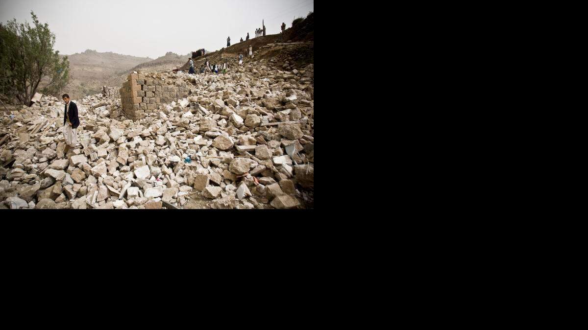 
Yemenis search for survivors in the rubble of houses destroyed by Saudi-led airstrikes in a village near Sanaa, Yemen, April 4, 2015. Saudi Arabia is leading a coalition trying to drive the rebels out of Yemen.
