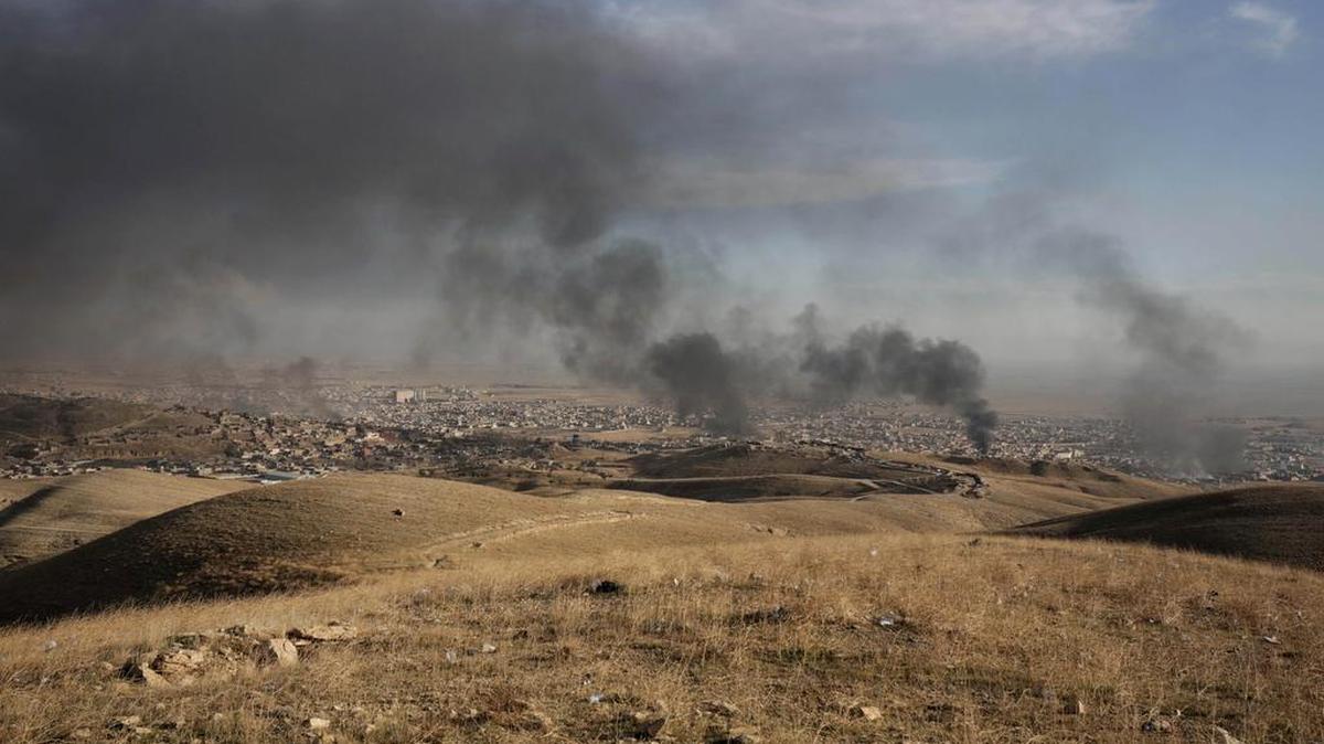 Smoke rises over Sinjar, northern Iraq from oil fires set by Islamic State militants in 2015. In 2016, militants could launch strategic attacks on the infrastructure of oil-producing nations across the Middle East, say experts. Worst-case: The attacks coincide with a fresh wave of violence in the oil-rich region of the Niger Delta, a coup in Venezuela and the death of Algerian President Abdelaziz Bouteflika.