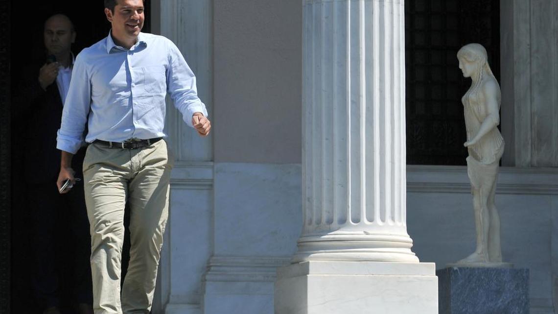 
Greek Prime Minister Alexis Tsipras leaves his office in Athens, on Thursday, Aug. 20, 2015. Tsipras has been contemplating his options after a parliament vote to approve the bailout conditions led to dozens of his own party lawmakers voting against him. 
