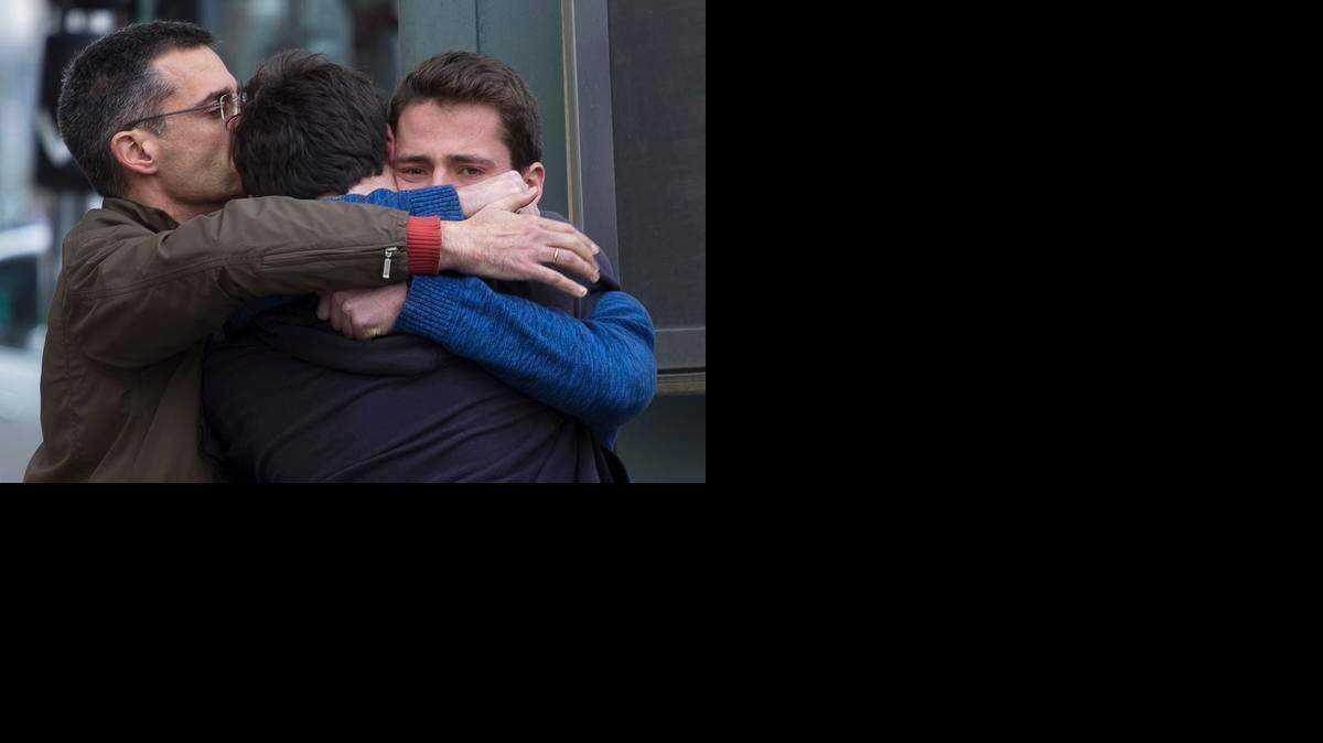 
Family members of people involved in a crashed plane comfort each other as they arrive at the Barcelona airport in Spain, Mar. 24, 2015. A Germanwings passenger jet carrying 150 people crashed in the French Alps region as it traveled from Barcelona to Duesseldorf in Germany.
