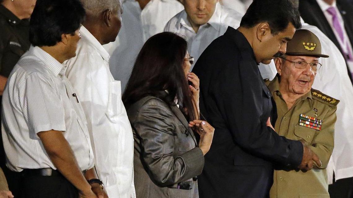 Cuban leader Raúl Castro embraces Venezuela's President Nicolas Maduro as he arrives to a rally honoring his deceased brother Fidel Castro at the Plaza of the Revolution in Havana, Cuba., Tuesday, Nov. 29, 2016. Schools and government offices were closed Tuesday for a second day of homage to Fidel Castro, with the day ending in a rally on the wide plaza where the Cuban leader delivered fiery speeches to mammoth crowds in the years after he seized power. Fidel Castro passed away Friday Nov. 25. He was 90. At left Bolivia's President Evo Morales. Third from right Venezuela's First Lady Cilia Flores.(AP Photo/Ricardo Mazalan)