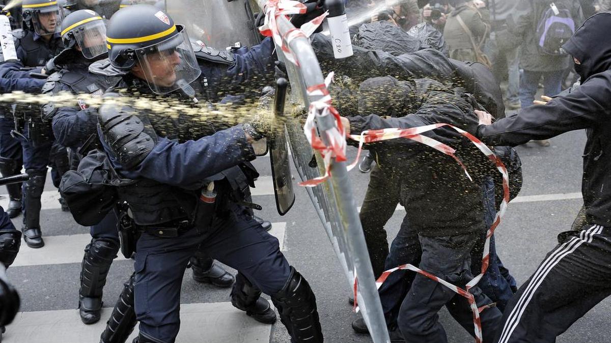 Policemen fight with activists during a protest ahead of the 2015 Paris Climate Conference at the place de la Republique on Sunday, Nov. 29, 2015. More than 140 world leaders are gathering around Paris for high-stakes climate talks that start Monday, and activists are holding marches and protests around the world to urge them to reach a strong agreement to slow global warming.