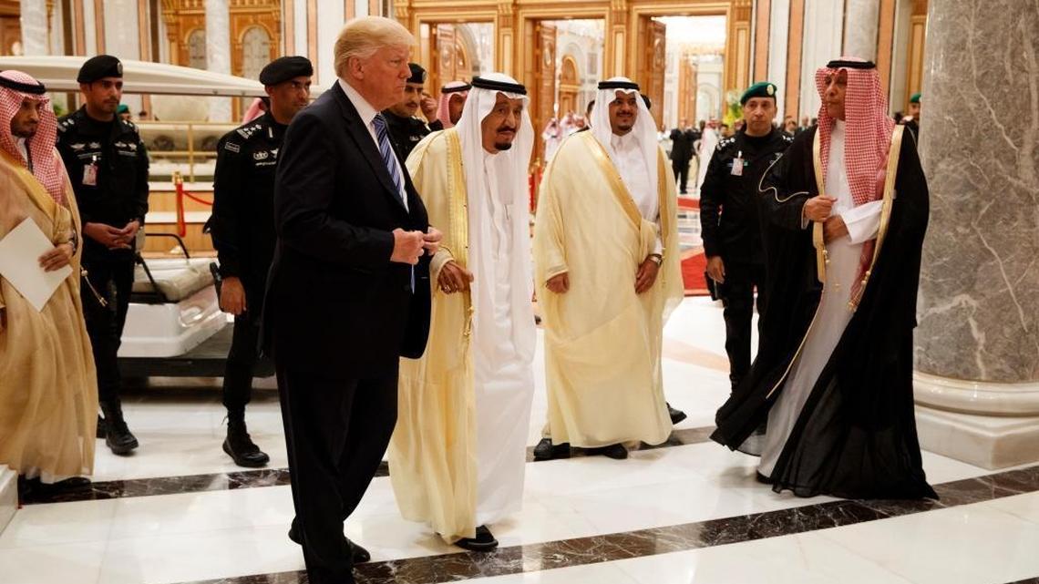 President Donald Trump and Saudi King Salman, center left, arrive to the Arab Islamic American Summit, at the King Abdulaziz Conference Center, Sunday, May 21, 2017, in Riyadh, Saudi Arabia.