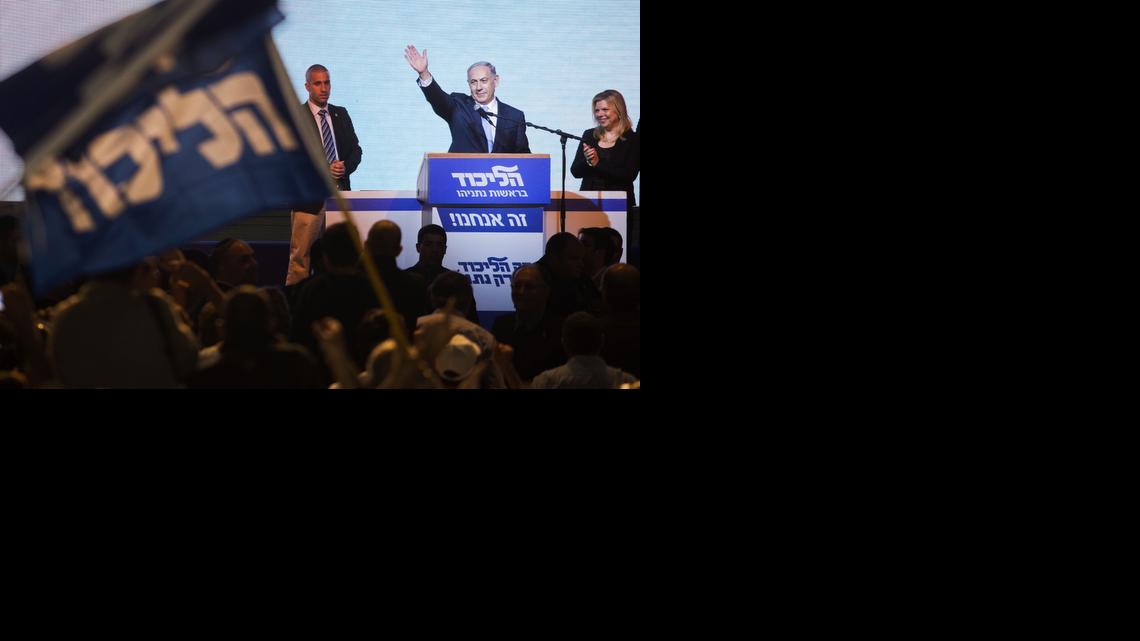 
Israeli Prime Minister Benjamin Netanyahu greets supporters at the party's election headquarters in Tel Aviv. Wednesday, March 18, 2015. Netanyahu's Likud Party scored a resounding victory in the country's election, final results showed Wednesday, a stunning turnaround after a tight race that had put his lengthy rule in jeopardy.
