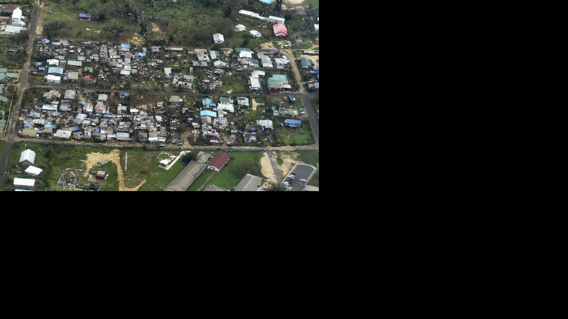
Damage to houses in Port Vila, Vanuatu is seen from the air in the aftermath of Cyclone Pam Monday, March 16, 2015. Vanuatu's President Baldwin Lonsdale said Monday that the cyclone that hammered the tiny South Pacific archipelago over the weekend was a "monster" that has destroyed or damaged 90 percent of the buildings in the capital and has forced the nation to start anew.
