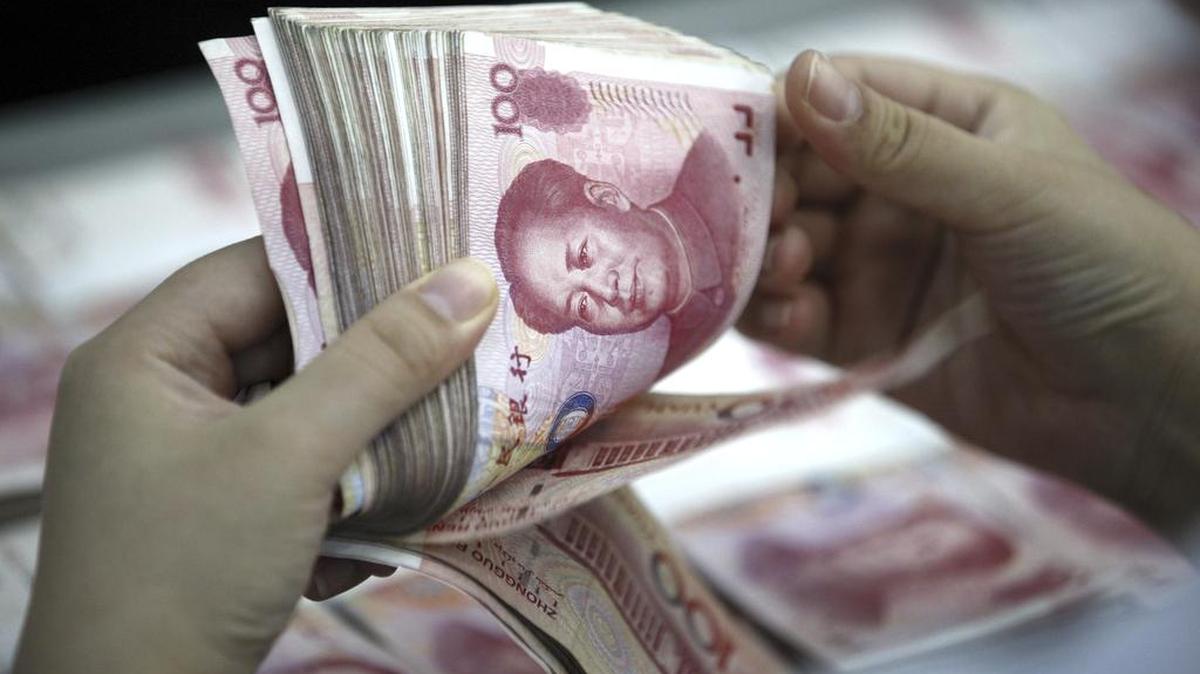 
A bank clerk counts renminbi banknotes in a bank branch in central China's Anhui province Wednesday as world frets about quality of nation’s economy. 
