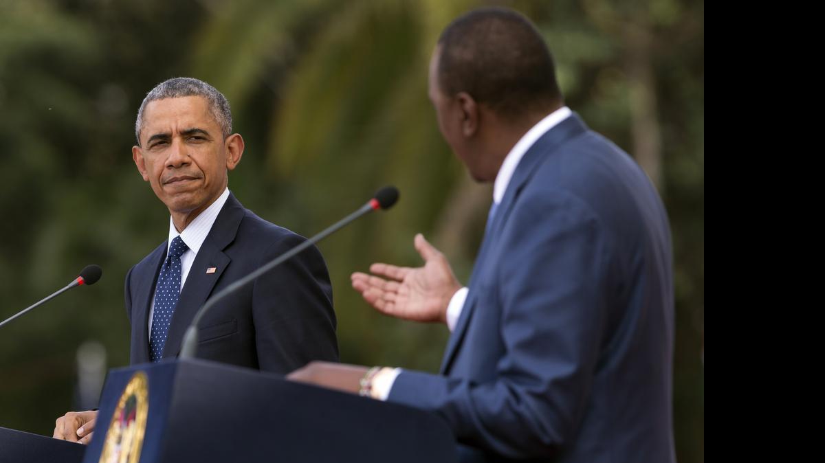 
President Barack Obama, left, listens as Kenyan President Uhuru Kenyatta speaks during a news conference at the State House on Saturday, July 25, 2015, in Nairobi. Obama nudged African nations Saturday to treat gays and lesbians equally under the law, a position that remains unpopular through much of the continent. 
