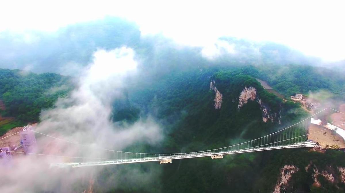 The world’s highest and longest glass bridge is completed in China.