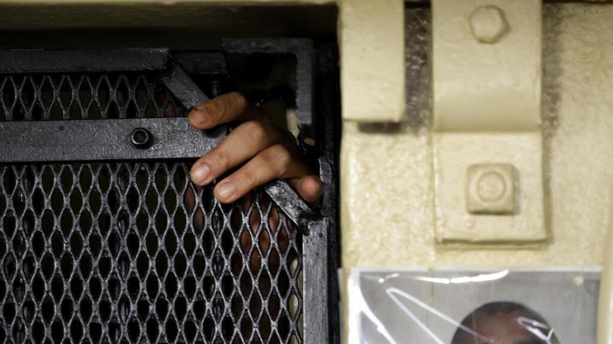 Martin Navarette reaches out of his cell on death row at San Quentin State Prison in San Quentin, Calif. With California's lethal injection protocol in limbo, the nearly 750 inmates at San Quentin State Prison, the nation’s most populous death row, are more likely to die from natural causes or suicide than execution. A new report puts the United States as the fifth-leading executioner in the world, noting that death penalties are up even though the number of nations employing capital punishment wanes.